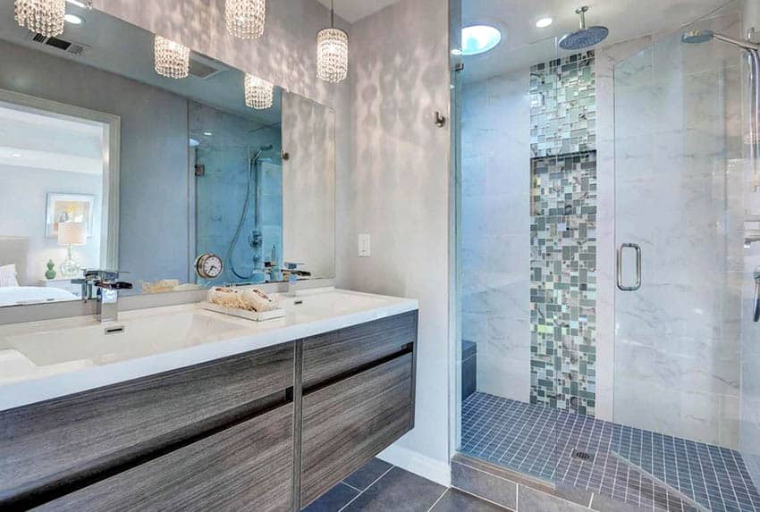 Bathroom with handleless cabinets. mirror and shower area