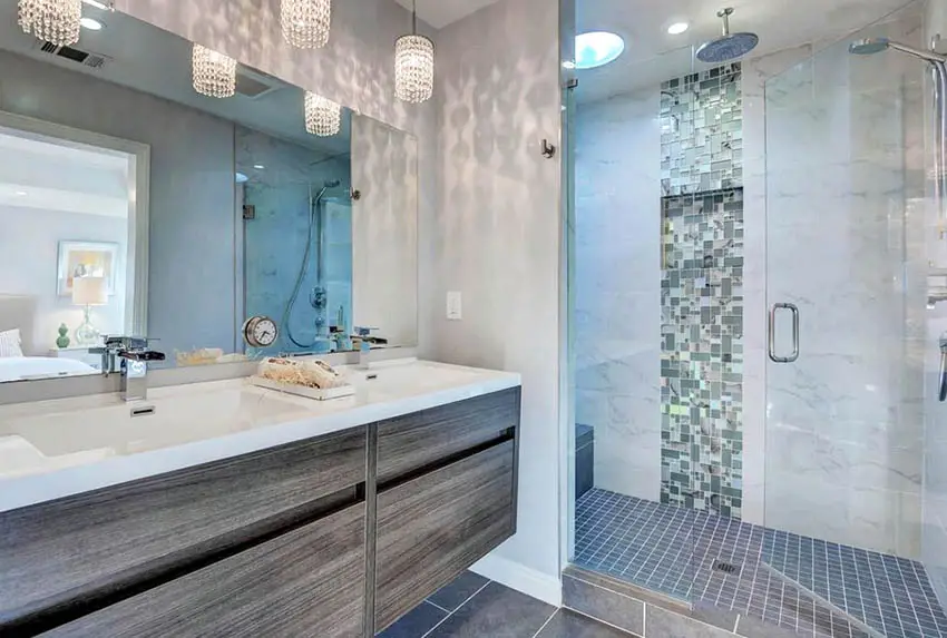 Bathroom with handleless cabinets. mirror and shower area