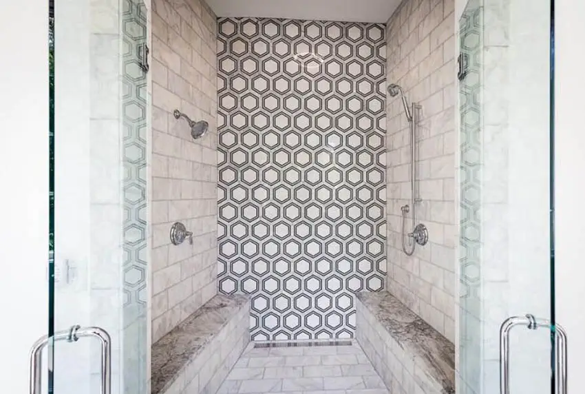 Shower with hexagonal tile and two benches