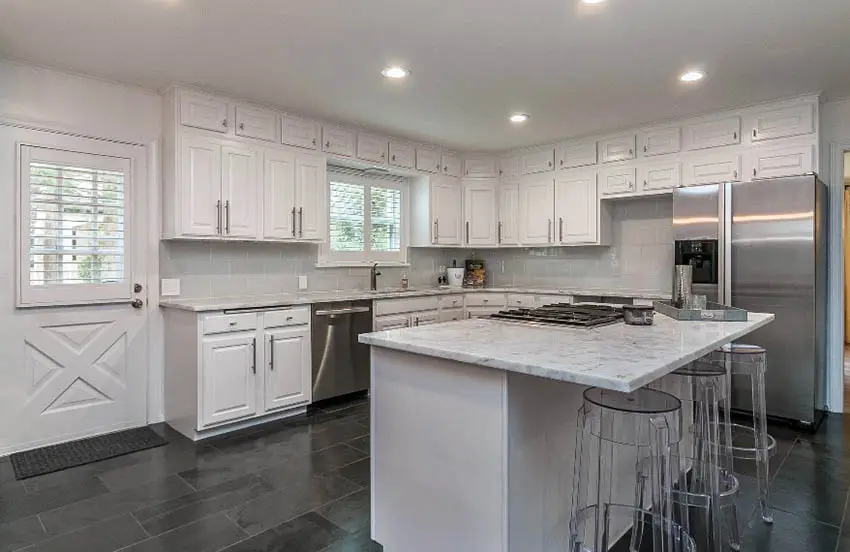 White kitchen with black slate flooring