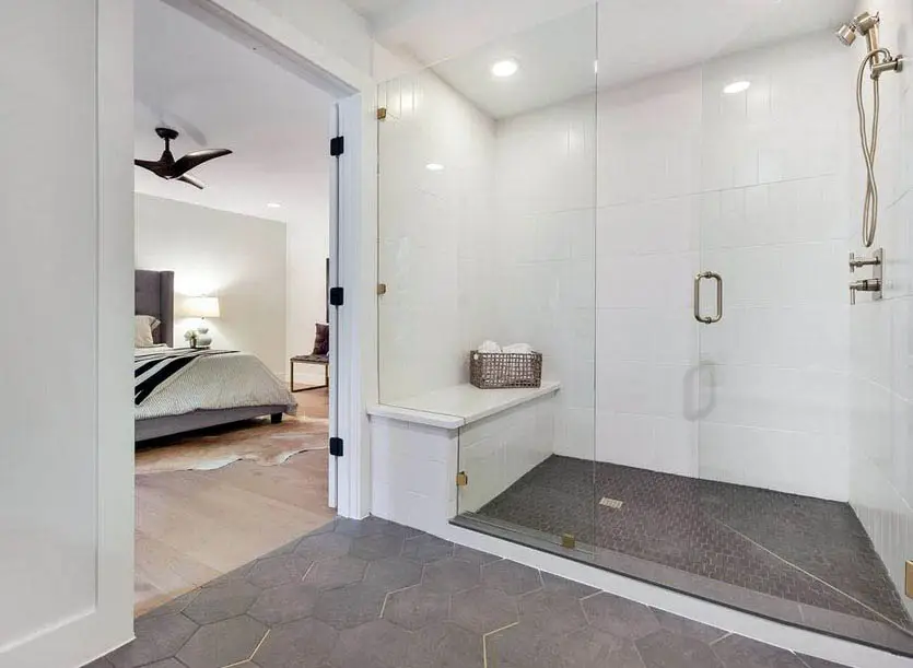 White walled shower with glass door 