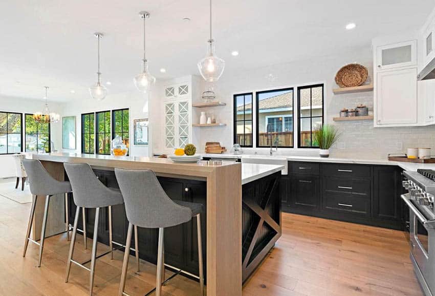 Contemporary kitchen with white subway tile white grout dark wood island with wood breakfast bar