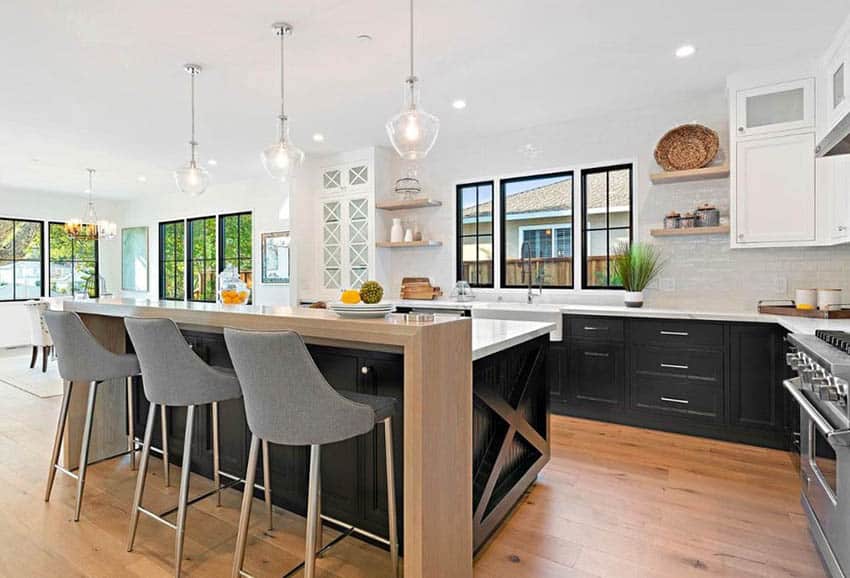 Contemporary kitchen with bi-level counter, glass lighting fixture