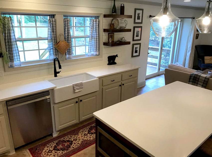 Farmhouse kitchen with shiplap backsplash and cream color cabinets