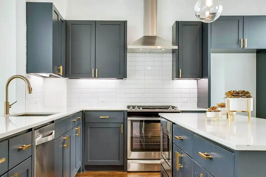 Kitchen with gold drawer pullouts and straight set type tile 