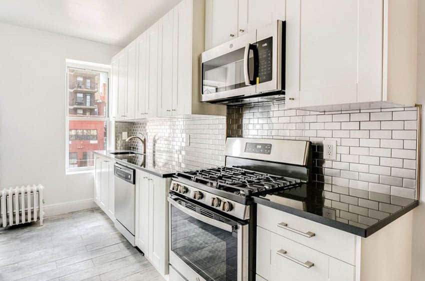 Kitchen with stainless steel subway tile backsplash