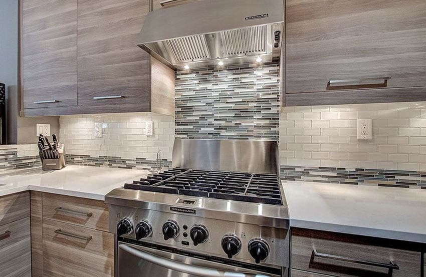 Kitchen with accent tile with wood veneer cabinets