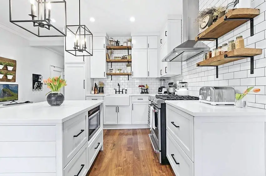 White kitchen with box pendant lights and wood accents