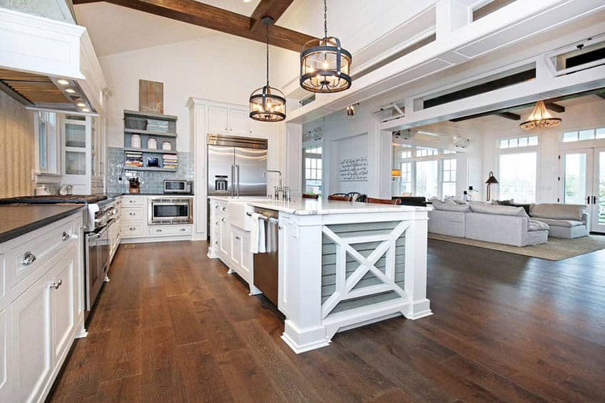 Large kitchen with shaker cabinets, gray shiplap accent island with marble countertops