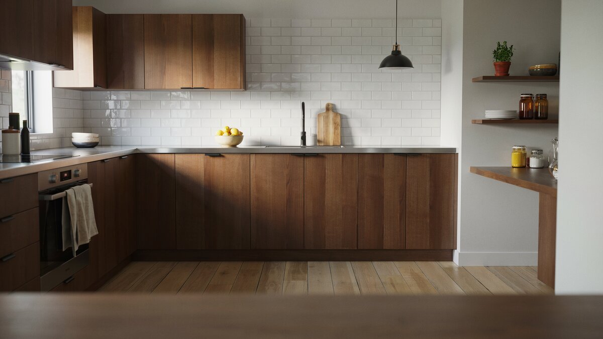 Dark walnut cabinets and white subway tile backsplash above stainless steel counters