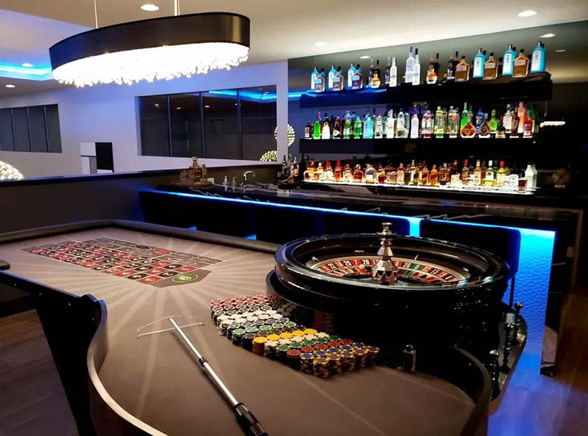 Man cave casino room with roulette and home bar