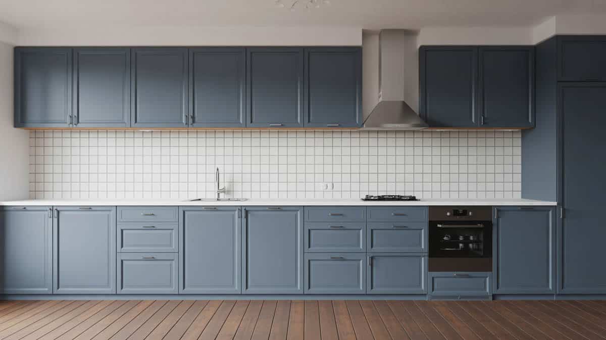All matte steel blue kitchen with Blanco Tulum countertops and teak floors