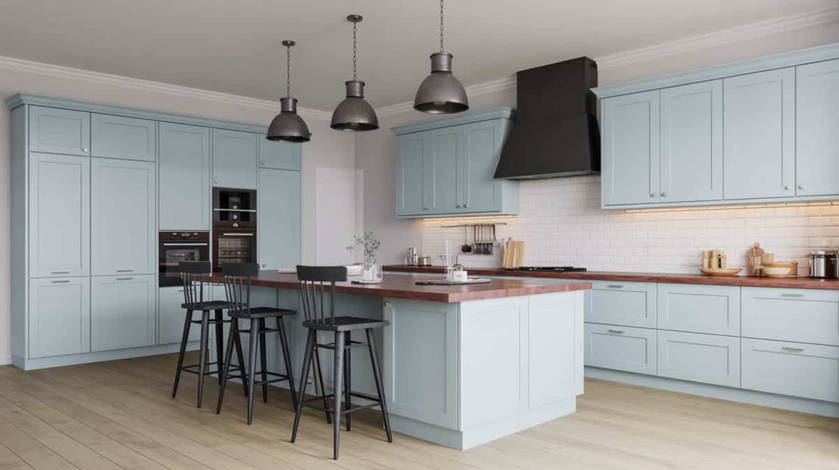 Powder blue shaker cabinets with open-plan layout and white butcher block island