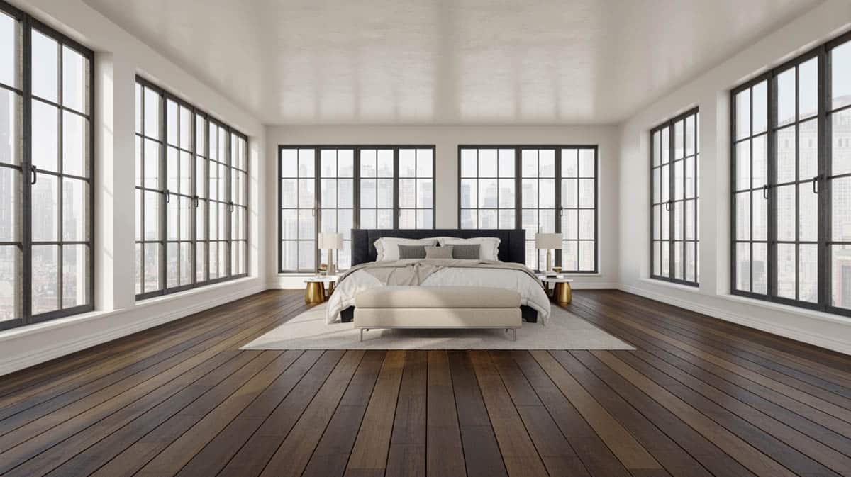Rustic bedroom with American walnut floors, white painted exposed framing, and vintage furniture