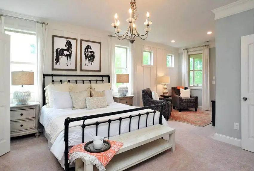 Master bedroom with chandelier and separate sitting area