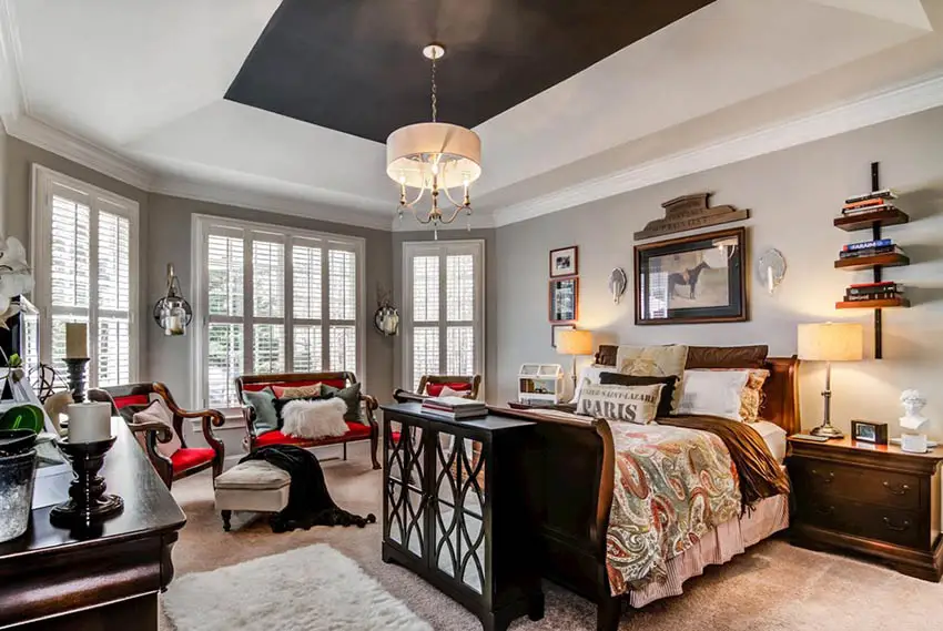 Bedroom with painted black tray ceiling