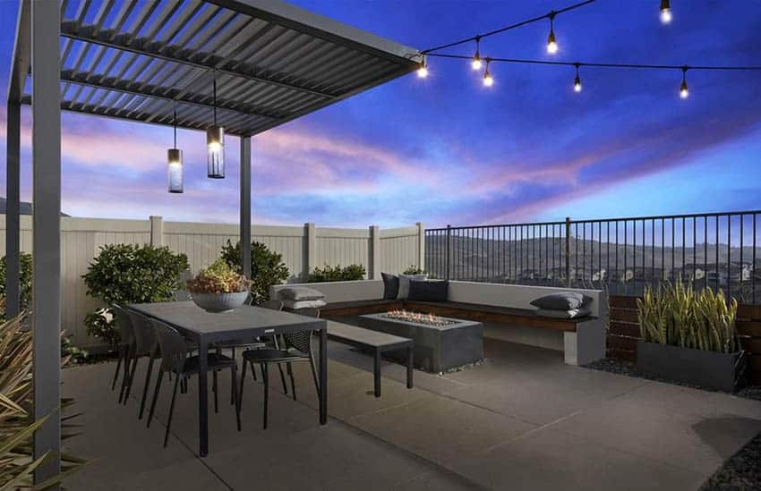 Contemporary backyard pergola with fire pit patio and string lighting