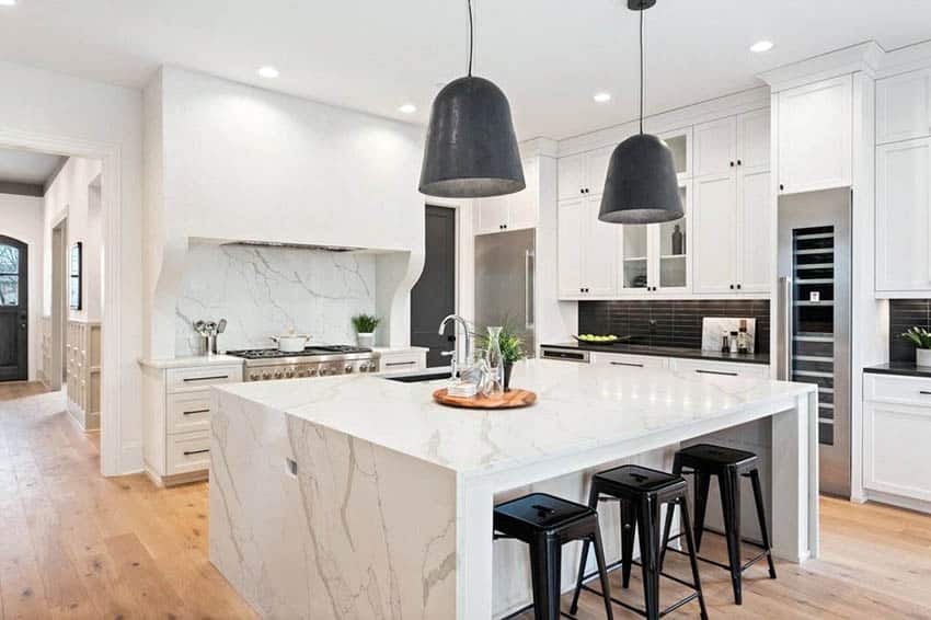 Contemporary Kitchen With White Cabinets White Quartz Countertops And Black Backsplash 