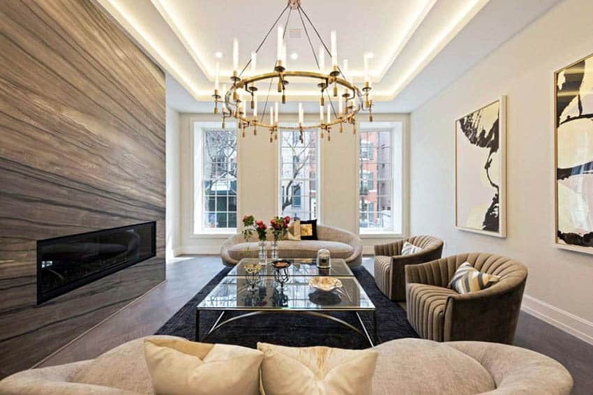 Contemporary living room with recessed tray ceiling lighting and chandelier