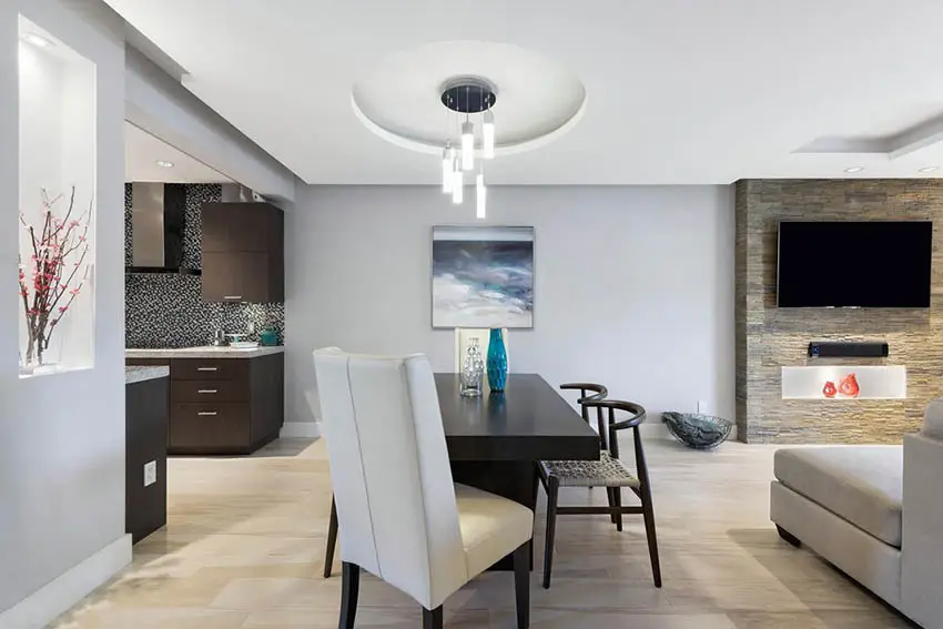 Dining room with circular tray ceiling pendant lighting