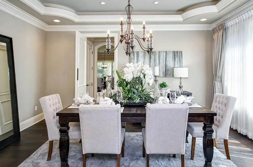 Dining room with rounded corner tray ceiling and chandelier
