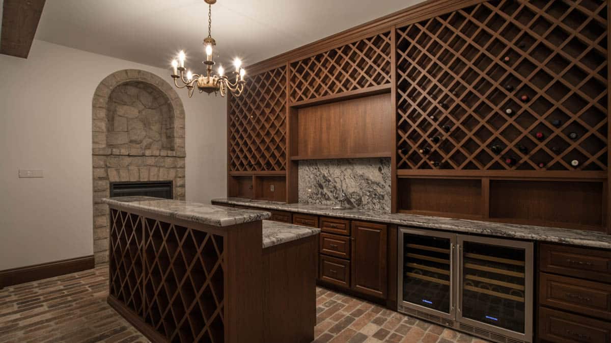 Bar with a wine bottle wall display, sunken conversation pit, and a Mediterranean-style fireplace