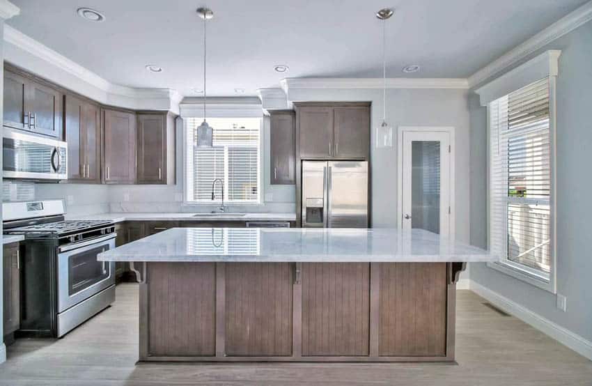 Kitchen with tan cabinets and greige wall