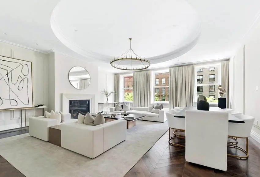 Living room with round tray ceiling and circular chandelier