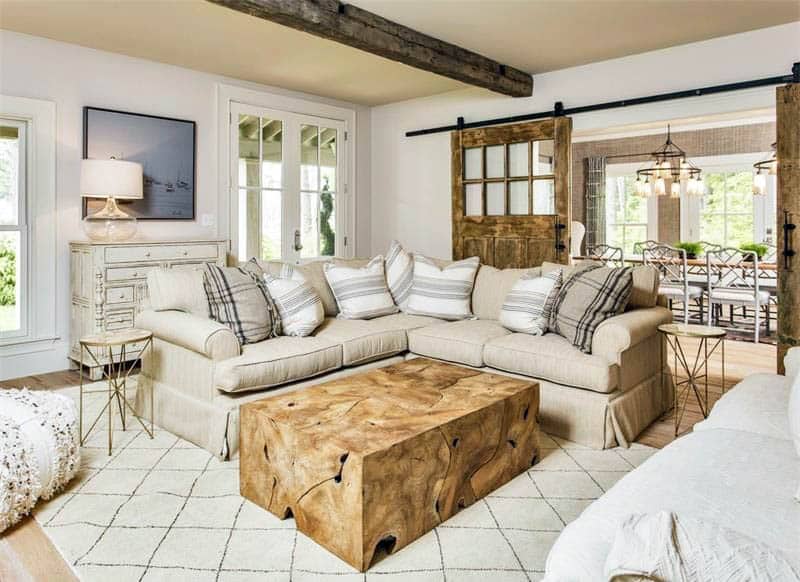 Open concept room with sliding barn doors to dining room