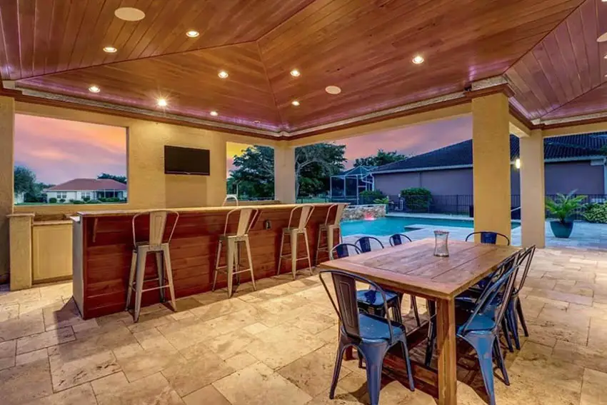 Covered patio with tongue and groove wood ceiling outdoor kitchen