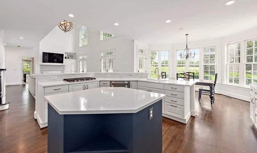 Custom kitchen island with geometric shape white quartz countertops