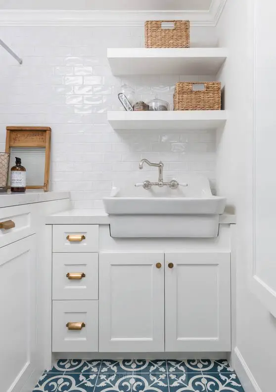Farmhouse style laundry with white subway tile and open shelving