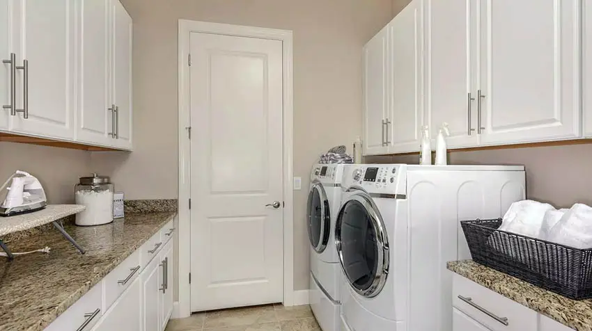 Finished laundry room with granite countertops