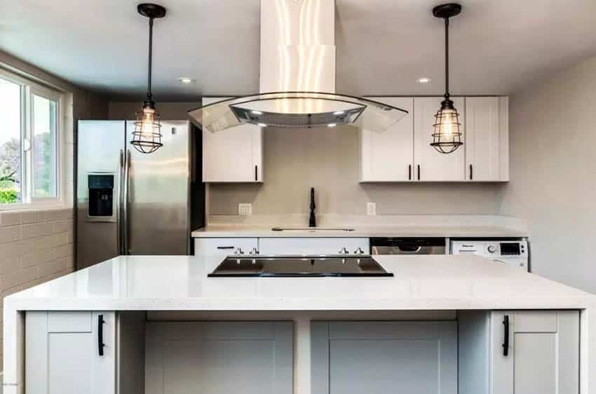 Kitchen island with stainless range hood with task lighting