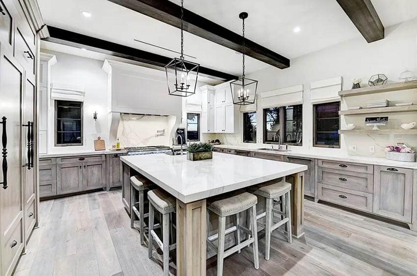 Kitchen with box pendant lighting wood cabinets marble countertops