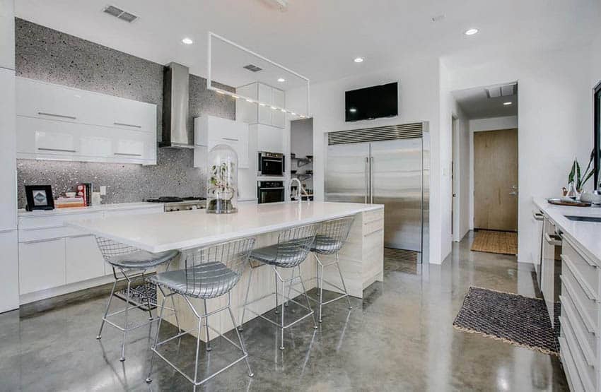 Kitchen with modern track lights above island