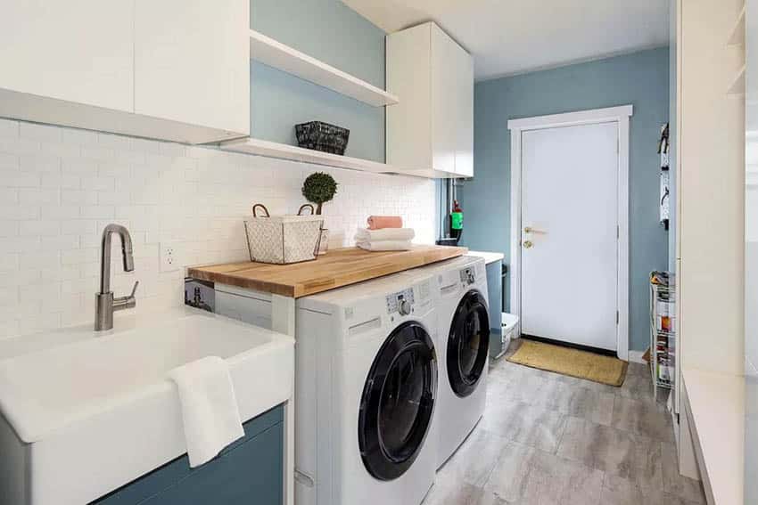 Laundry Room With Washer Dryer Wood Surround Sink Subway Tile Backsplash 