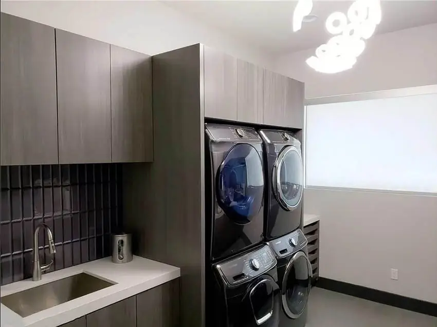 Modern laundry room with washing machne enclosure