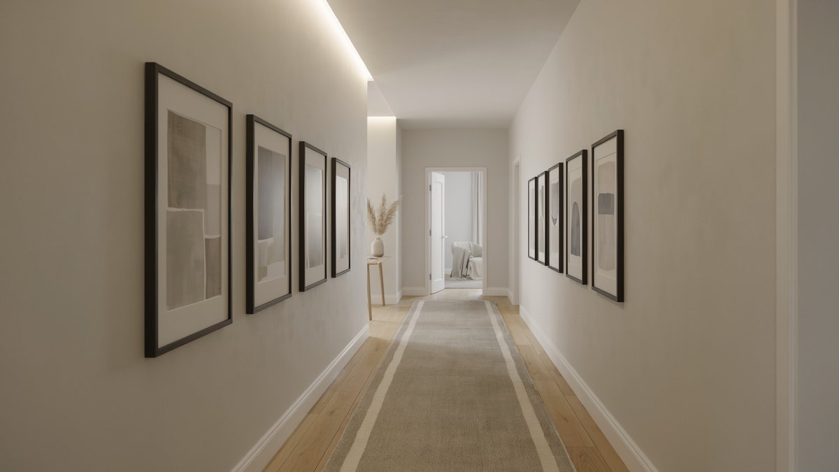 Hallway lined with black framed prints at eye level above a striped runner rug