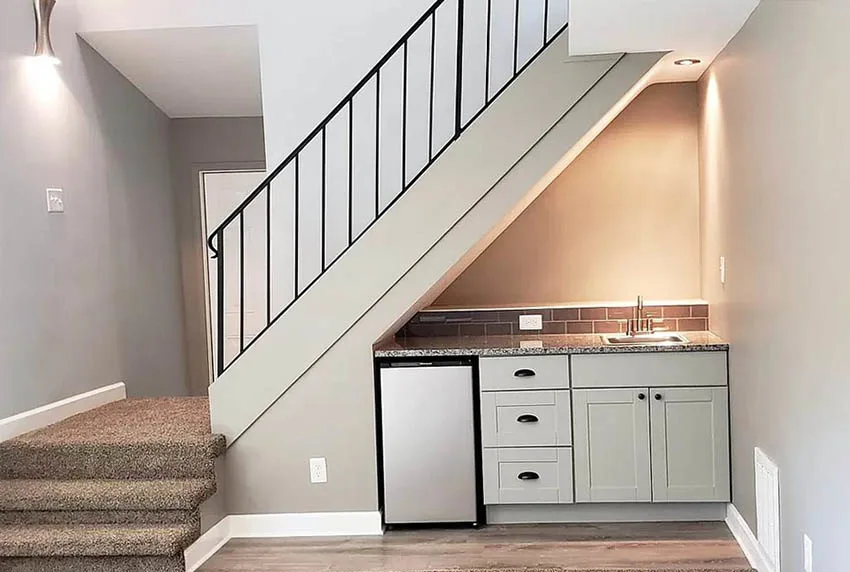 Small basement kitchen under staircase