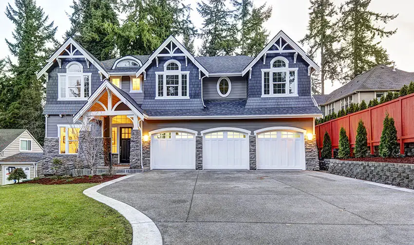 3 car garage with white doors and windows