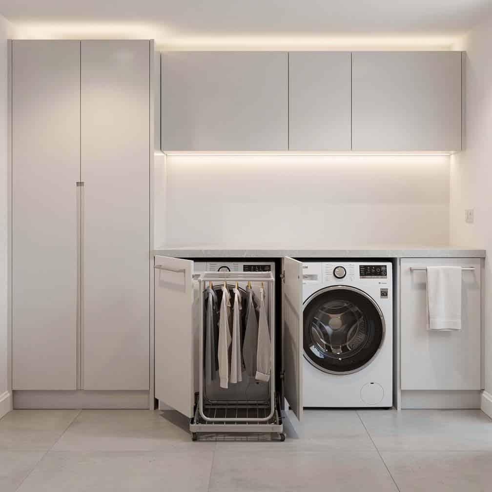 Modern built-in basement laundry with integrated pull-out drying rack
