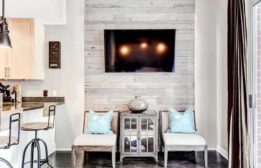 Living room with wood feature wall and hanging tv