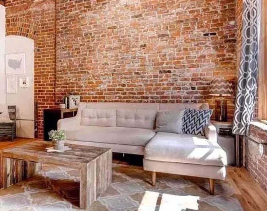Brick wall living room with chaise lounge sectional sofa