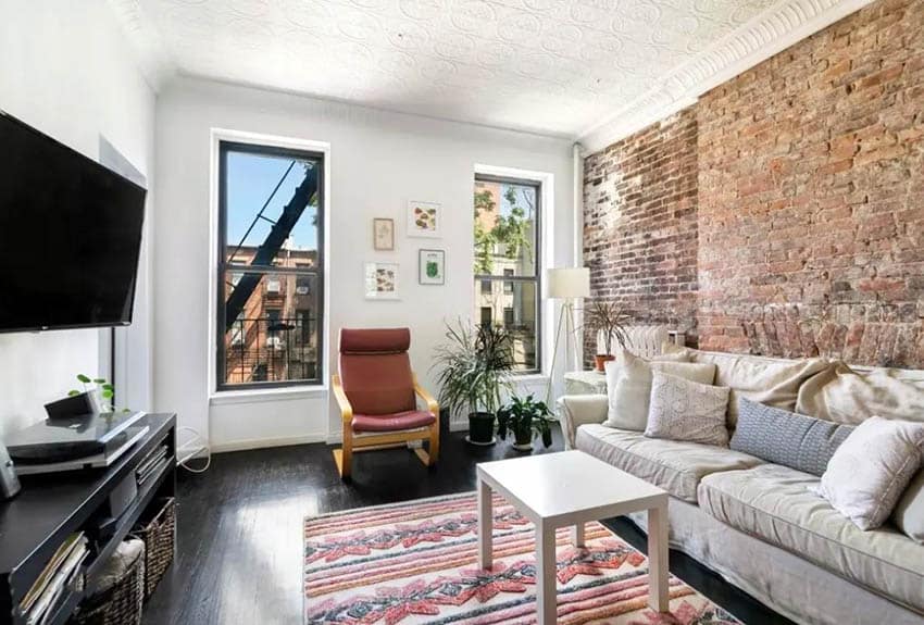 Cozy living room with exposed brick wall