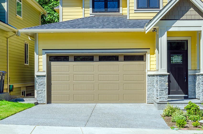 Yellow painted house with grey roofing