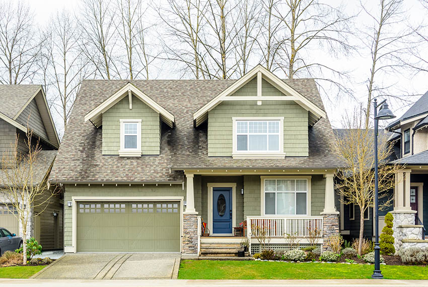 Green garage door with small windows