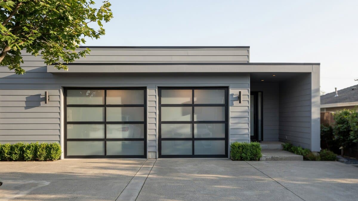 Paired glass doors mixing frosted and clear panes in black framing