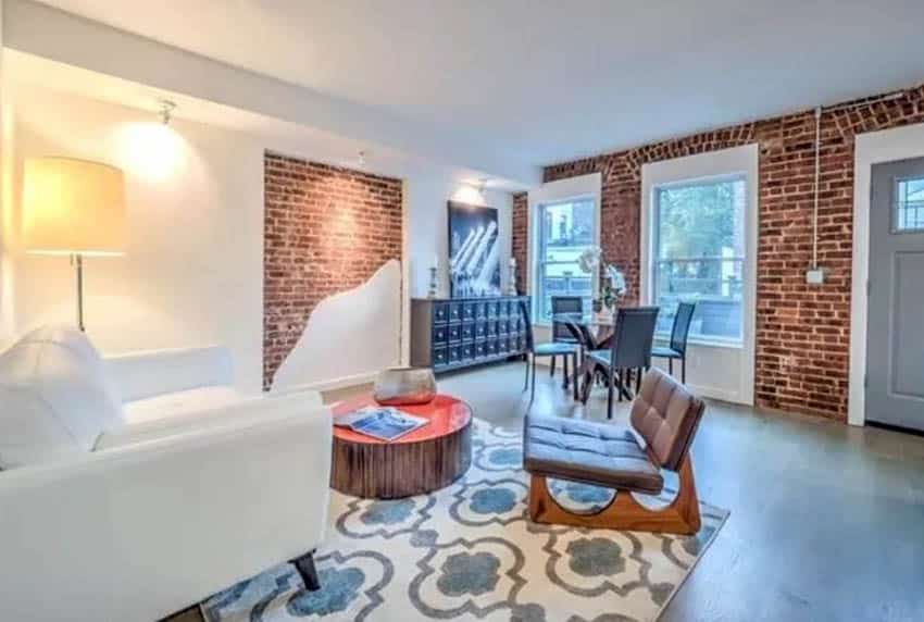 Half exposed brick wall living room with accent lights