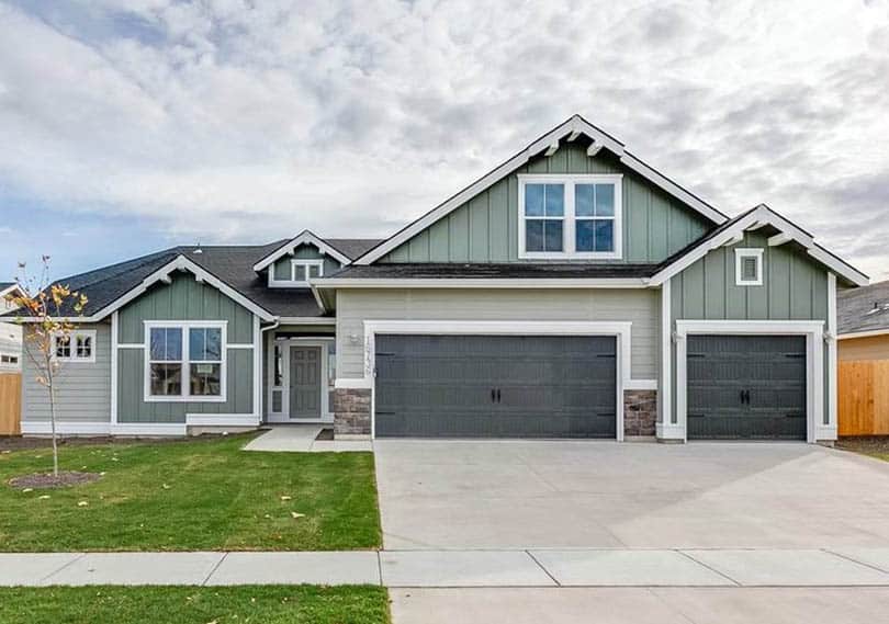 Home with wide driveway and garage